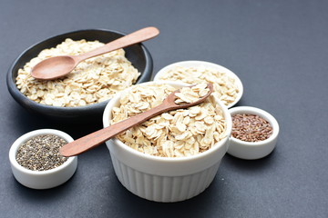 Natural oatmeal on light wooden background