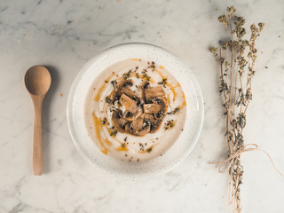 White soup, creamy and rustic with mushroom . Autumn warm puree. Vegetarian healthy food. Top view white background. 5