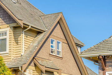 The roof of the house with nice window.