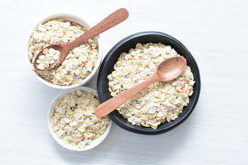 Natural oatmeal on light wooden background