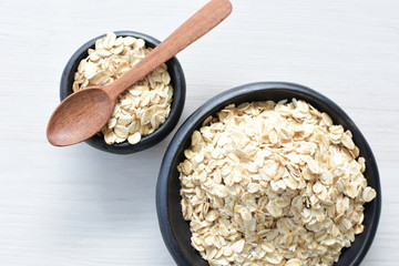 Natural oatmeal on light wooden background