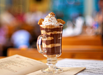 Hot chocolate with cream and biscuit