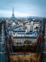 Paris, France, winter  evening cityscape, view of Eiffel tower, from  Arc de Triomphe (Triumphal arch) top. Aerial city scene.
