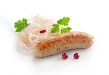 Fried sausage with sauerkraut, cranberry and fresh parsley