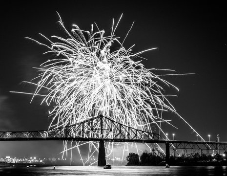 Photograph of fireworks. Jacques Cartier bridge with fireworks. Montreal Quebec. Fireworks.