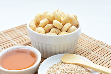Quinoa cereal, accompanied by seeds and honey