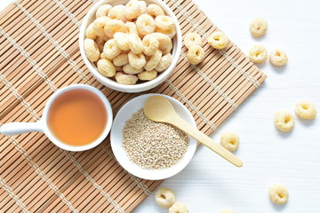 Quinoa cereal, accompanied by seeds and honey