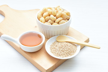 Quinoa cereal, accompanied by seeds and honey