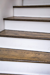 stained wood and white painted steps in a new and modern home