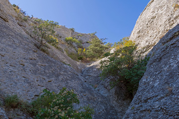 Riverbed pierced in the stone by rain and melt water. Crimean mountains.