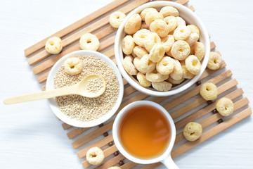 Quinoa cereal, accompanied by seeds and honey