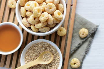 Quinoa cereal, accompanied by seeds and honey