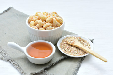 Quinoa cereal, accompanied by seeds and honey