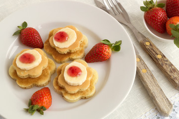 pancakes with jam and strawberries.
