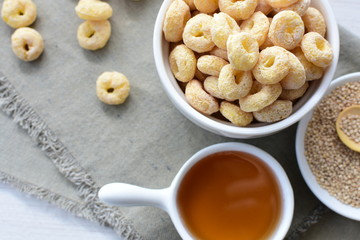 Quinoa cereal, accompanied by seeds and honey