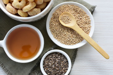 Quinoa cereal, accompanied by seeds and honey