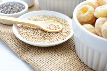 Quinoa cereal, accompanied by seeds and honey