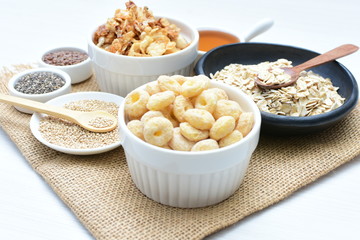 Quinoa cereal, accompanied by seeds and honey