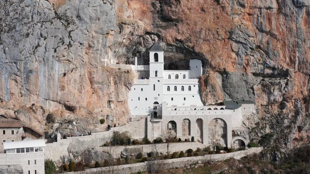 Ostrog Monastery in Montenegro founded in 17th cent- St. Basil (Sveti Vasilije). This pilgrimage place is managed by Serbian Orthodox Church and is situated high up in a vertical rock. Aerial footage.