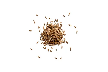 Fotobehang Top view of a pile of organic dry cumin seeds isolated on a white background © ydumortier