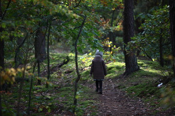 little girl in a forest