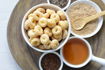 Quinoa cereal, accompanied by seeds and honey