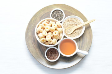 Quinoa cereal, accompanied by seeds and honey