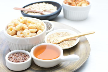 Quinoa cereal, accompanied by seeds and honey