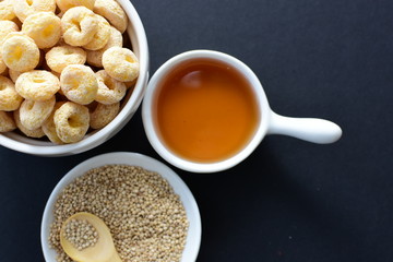 Quinoa cereal, accompanied by seeds and honey