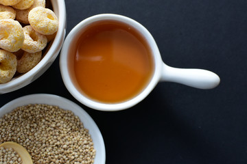 Quinoa cereal, accompanied by seeds and honey