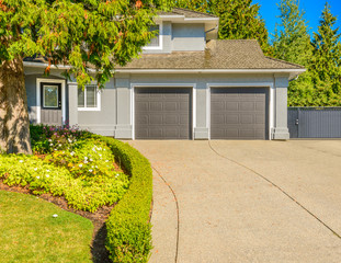Luxury house with triple garage door in Vancouver, Canada.