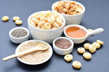 Quinoa cereal, accompanied by seeds and honey