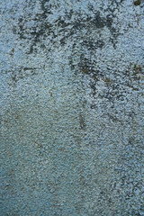 Blue grungy wall stone background with black patterns. Top view