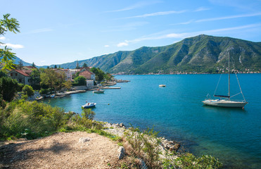 Fototapeta na wymiar Summer landscape of the Kotor bay with views of mountains and old town, Montenegro