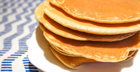 A stack of delicious lush pancakes on a plate. Homemade