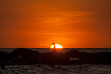 Obraz premium Fishermen sunset Jaco Beach