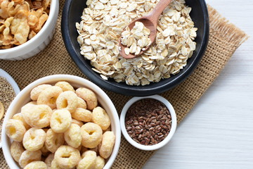Granola mix accompanied by seeds and honey