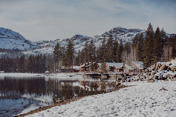 Beautiful vacation cabins with snowy rooftops on a Winter day at Donner Lake.