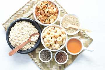 Granola mix accompanied by seeds and honey