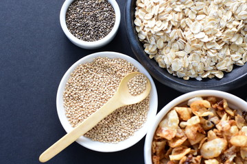 Granola mix accompanied by seeds and honey