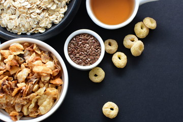 Granola mix accompanied by seeds and honey