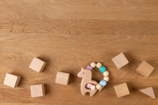 Baby kid educational natural eco zero waste wooden toys on wood background