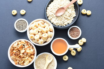 Granola mix accompanied by seeds and honey