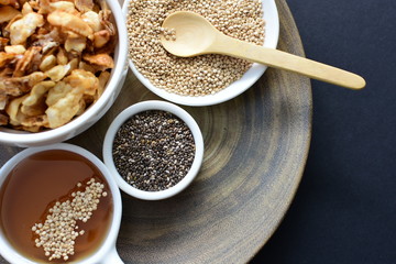 Granola mix accompanied by seeds and honey