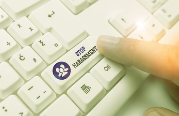 Conceptual hand writing showing Stop Harassment. Concept meaning Prevent the aggressive pressure or intimidation to others