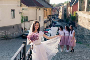 Beautiful bride with her bridesmaids enjoing hen party