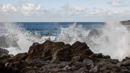 waves breaking on the rocks