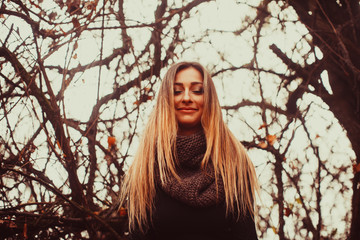 Autumn mood. Fall lifestyle portrait of stylish girl with long hair.