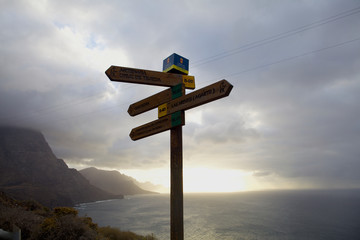 wooden signpost on blue sky Sicily Italy  © Marta