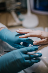 closeup of a woman making manicure